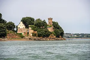 Chateau Prints: Chateau de Phou stands tall on a wooded peninsula in Rance estuary surrounded by water in Brittany