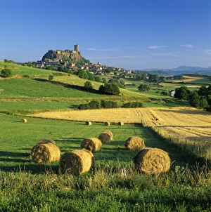Auvergne Prints: Chateau de Polignac and hay bales, Polignac, Haute-Loire, Auvergne, France, Europe