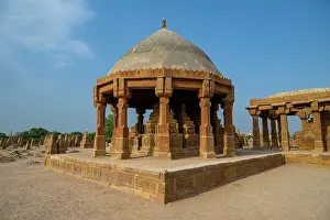 Stones Prints: Chaukhandi tombs display intricate stone carvings and unique architectural design during daylight in Pakistan