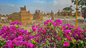 Burial Prints: Chaukhandi tombs stand amid blooms and earth in Karachi Pakistan showcasing rich history and culture of Sindh