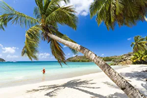 Mid Adults Prints: Cheerful woman sunbathing in the crystal Caribbean sea