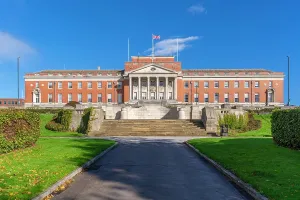 Center Prints: Chesterfield Town Hall stands in autumn with clear skies and vibrant foliage in front of the building in Derbyshire