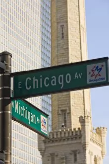 Chicago and Michigan Avenue signposts with the Historic Water Tower behind