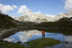 Images Dated 21st August 2010: Child playing on an alpine pond, Dolomites, eastern Alps, Belluno province, Italy, Europe