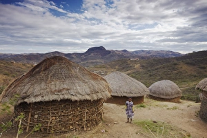 Huts Prints: Child standing in village in hills, Eshowe, Zululand, KwaZulu-Natal, South Africa, Africa