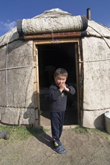 Yurt Prints: Child in yurt, tent of Nomads at Song Kol, Kyrgyzstan, Central Asia, Asia