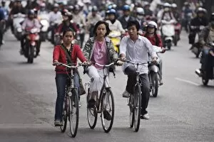 Children on bicycles, Hanoi, Vietnam, Indochina, Southeast Asia, Asia