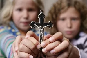Children holding a crucifix, Haute Savoie, France, Europe