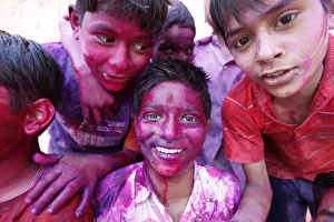 Stereotypically Indian Prints: Children at Holi celebration in Goverdan, Uttar Pradesh, India, Asia