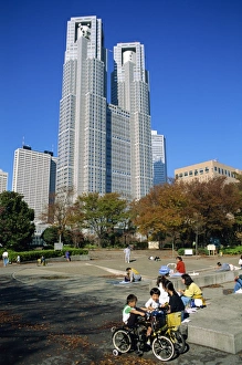 Shinjuku Prints: Children play in a park below the New Tokyo City Hall in Shinjuku