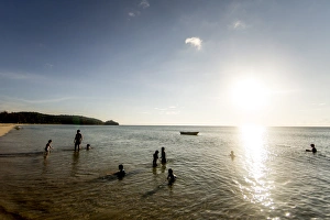Children play on Simpang Mengayau beach, an emerging eco tourism destination in the Tun Mustapha Park, Malaysian Borneo, Malaysia, Southeast Asia, Asia