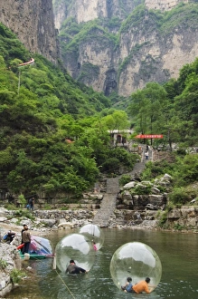 Henan Prints: Children playing on river inflatables, Wan Xian mountain recreation area