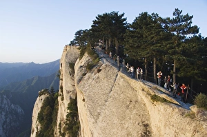 Chinese people waiting for sunrise on top of Hua Shan, a granite peaked mountain