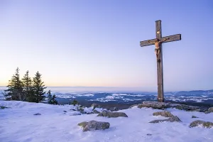 Wintry Landscape Prints: Christian cross on the peak of Mount Lusen with the view over the hills of the bavarian forest at sunrise at winter