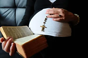 Rosary Prints: Christian pregnant woman reading the Bible, Paris, France, Europe