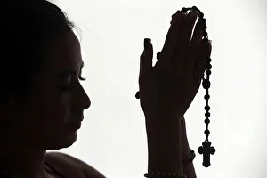Females Prints: Christian woman praying the Rosary, Vietnam, Indochina, Asia