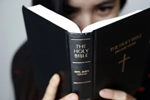 Typically Vietnamese Prints: Christian woman reading the Holy Bible, Vietnam, Indochina, Southeast Asia, Asia