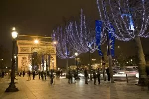 Christmas lights and the Arc de Triomphe, Paris, France, Europe