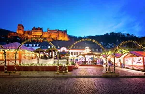 Typically German Gallery: Christmas Market at Karlsplatz in the old town of Heidelberg, with Castle Heidelberg, Heidelberg