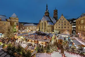 Adults Prints: Christmas market on Schillerplatz square in front of Stiftskirche church