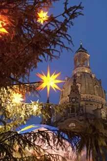Images Dated 11th December 2009: Christmas tree star decoration and Frauen Church at Christmas Market at twilight
