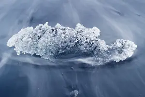 Lagoons Prints: Chunk of ice washed by sea, Diamond beach near Jokulsarlon glacier lagoon