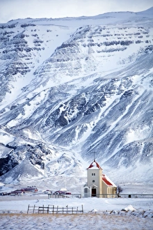 Snaefellsnes Peninsula Gallery: Church and isolated farm against snow covered mountains, winter afternoon on the