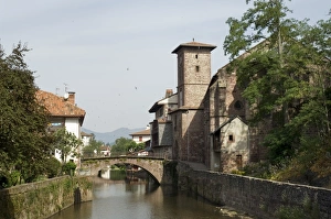 Pyrenees Atlantique Prints: Church of Our Lady on right of old bridge, St. Jean Pied de Port, Basque country