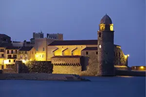 Collioure Prints: The Church of Notre-Dame-des-Anges at dusk from the harbour at Collioure