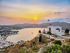 Patriotism Prints: Church of Prophet Elias above the town of Agia Marina at sunset