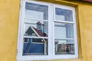 Sisimiut Prints: Church reflected in brightly painted house window in Sisimiut, Greenland, Polar Regions