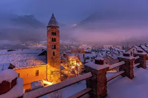 Enjoy Prints: Church of Saint Pantalon and snow covered town centre and mountainous background in winter at dusk