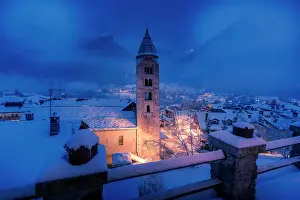 Pantalon Prints: Church of Saint Pantalon and snow covered town centre and mountainous background in winter at dusk