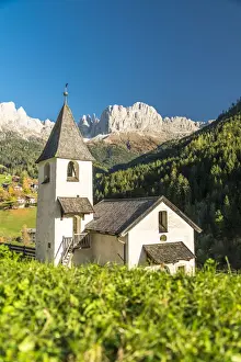 Bell Tower Prints: Church of San Cipriano with Catinaccio and Torri del Vajolet mountains in background