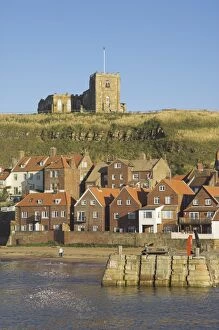 Church, sandy beach and harbour, Whitby, North Yorkshire, Yorkshire, England