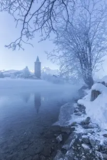 River Inn Prints: The church of Sils-Baselgia, in a winter landscape covered in snow in Engadine