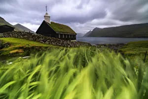 Funningur Prints: Church with traditional grass roof oceanfront, Funningur, Eysturoy island, Faroe Islands