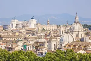 Churches and domes of the Rome skyline showing Victor Emmanuel II monument in the distance