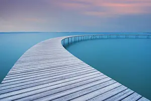 Aarhus Prints: The circle shaped wooden bridge (Infinity Bridge) at dusk