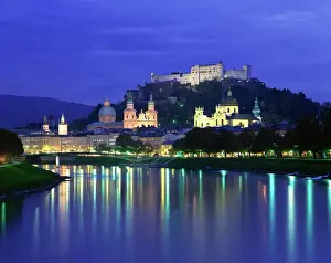 City and castle at night from the river, Salzburg, Austria, Europe