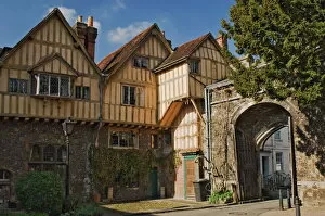 Images Dated 16th April 2008: A city gate with timbered infilled gabled building, Winchester, Hampshire