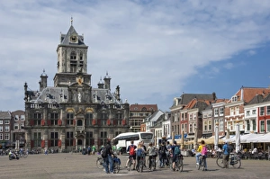 Delft Prints: City Hall, Main Square, local cyclists, Delft, Holland, Europe