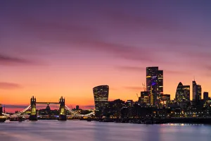 Light Beam Prints: The City of London skyline at sunset including Tower Bridge