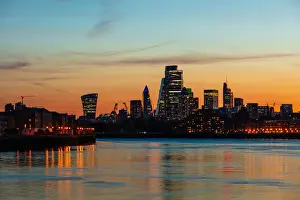Light Beam Prints: The City of London skyline at sunset reflecting in River Thames