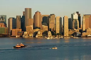 City skyline at dawn across Boston Harbor