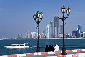 View From Behind Prints: City skyline and the famous Corniche looking across the harbour from a pier