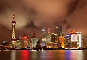 Pu Dong Prints: City skyline at night with Oriental Pearl Tower and Pudong skyscrapers across the Huangpu River