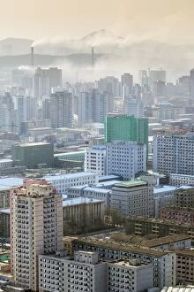 Chimney Collection: City skyline and pollution from coal fired power plants, Pyongyang