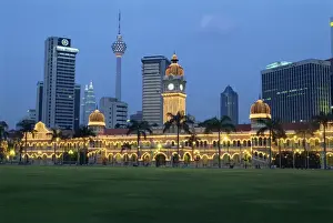 City skyline and the Sultan Abdul Samad Building illuminated at dusk
