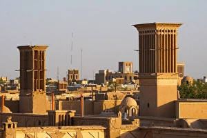 Typically Iranian Prints: Cityscape at dusk with many windtowers (badgirs), Yazd, Iran, Middle East